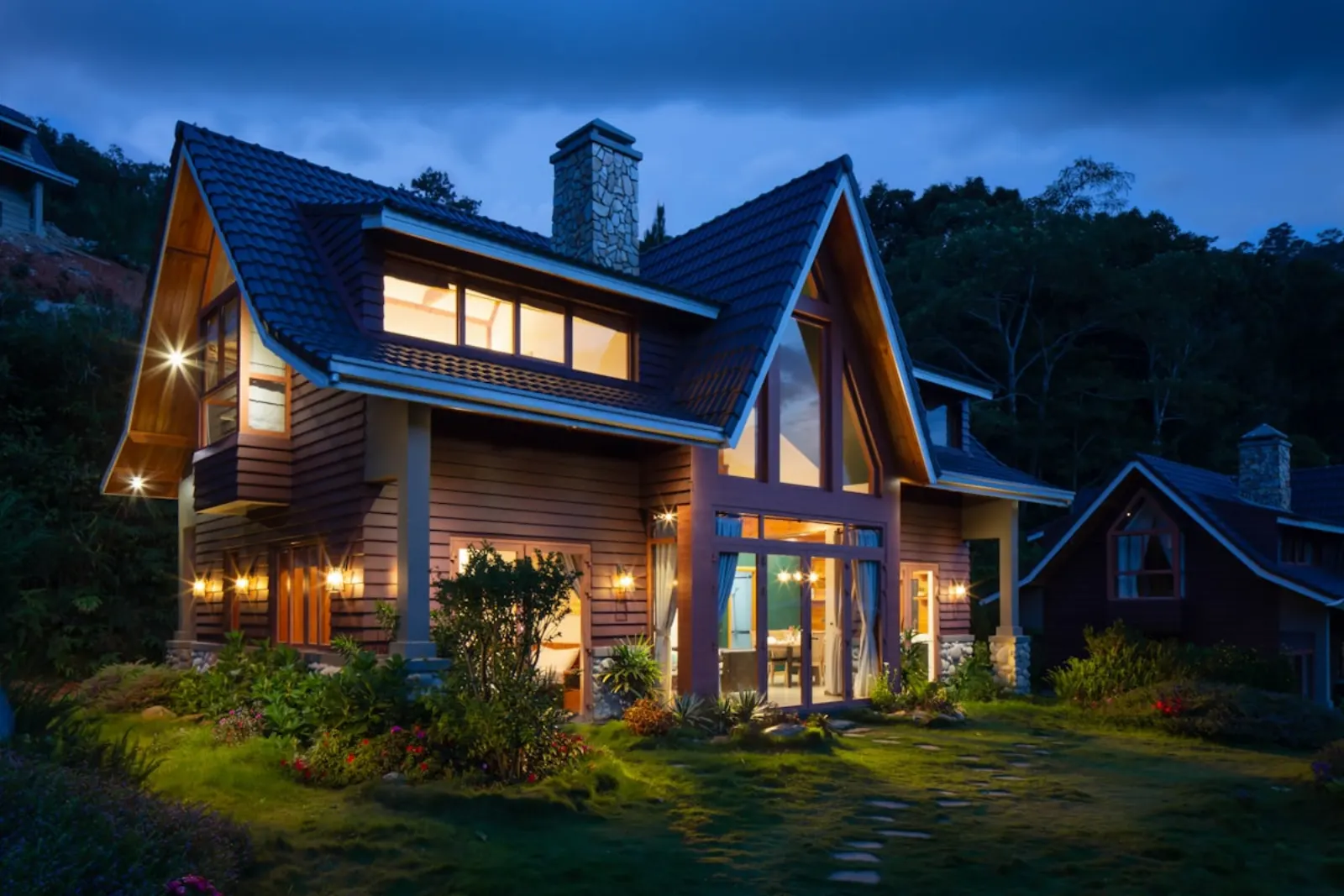 A warm home exterior at dusk